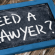 A marketing image for an attorney advertising the slogan "Need a Lawyer?"