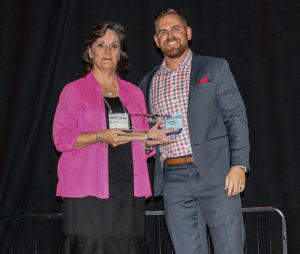 A. Michelle Campney, Phillips Murrah Construction Law Attorney, accepts ASA-OK's Service Provider of the Year award on behalf of the Firm.