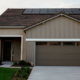 A home with solar panels provides excess power for the owner to sell to utility companies