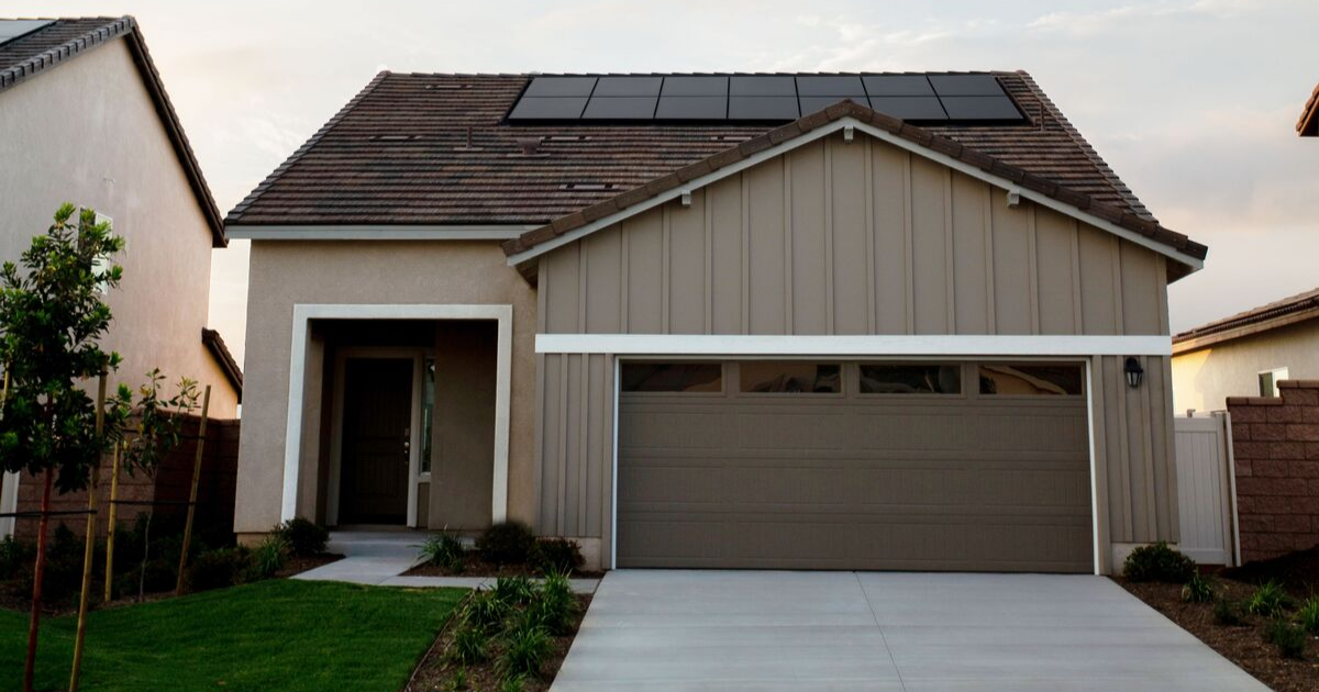 A home with solar panels provides excess power for the owner to sell to utility companies