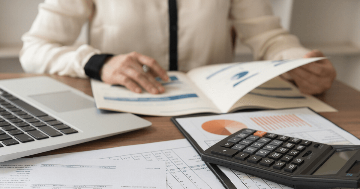 A woman works on her business audit, which is partially made easier by the Bipartisan Budget Act of 2015