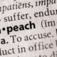 A close up image of the word impeach and part its dictionary definition, which is "to accuse."