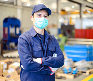 Stock image of industrial worker wearing a mask