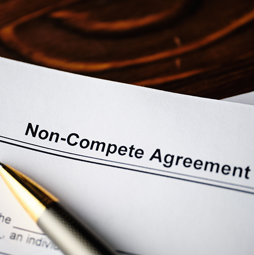 Legal document Non-Compete Agreement on paper close up.