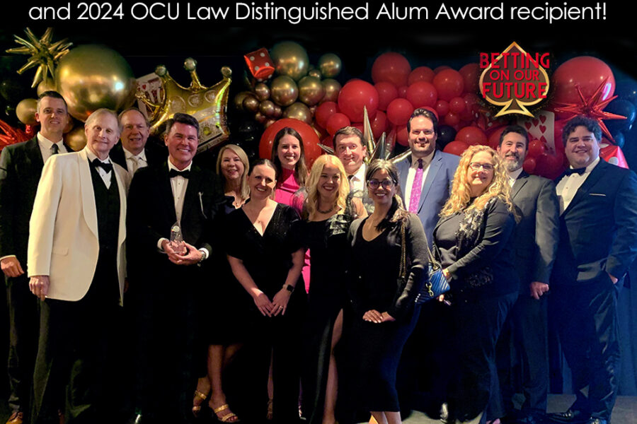 Graphic featuring attorneys on stage posing for a photo.