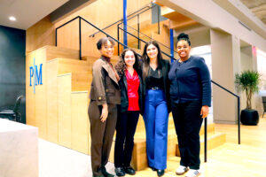 Group photo of 2024 PM Fellows in law firm lobby.