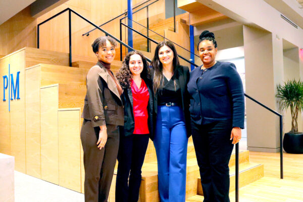 Group photo of 2024 PM Fellows in law firm lobby.