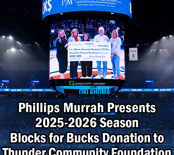 5 people holding a presentation check at a backetball game