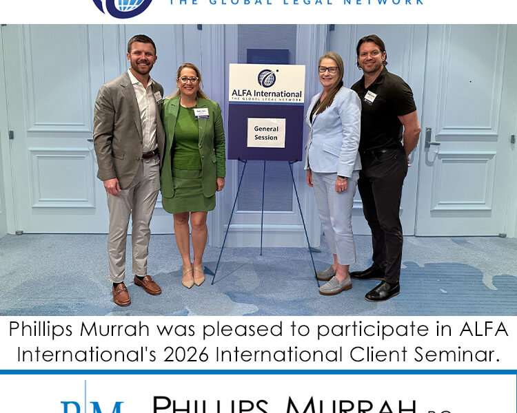 Featured image graphic with four people posing for a photo during a conference.