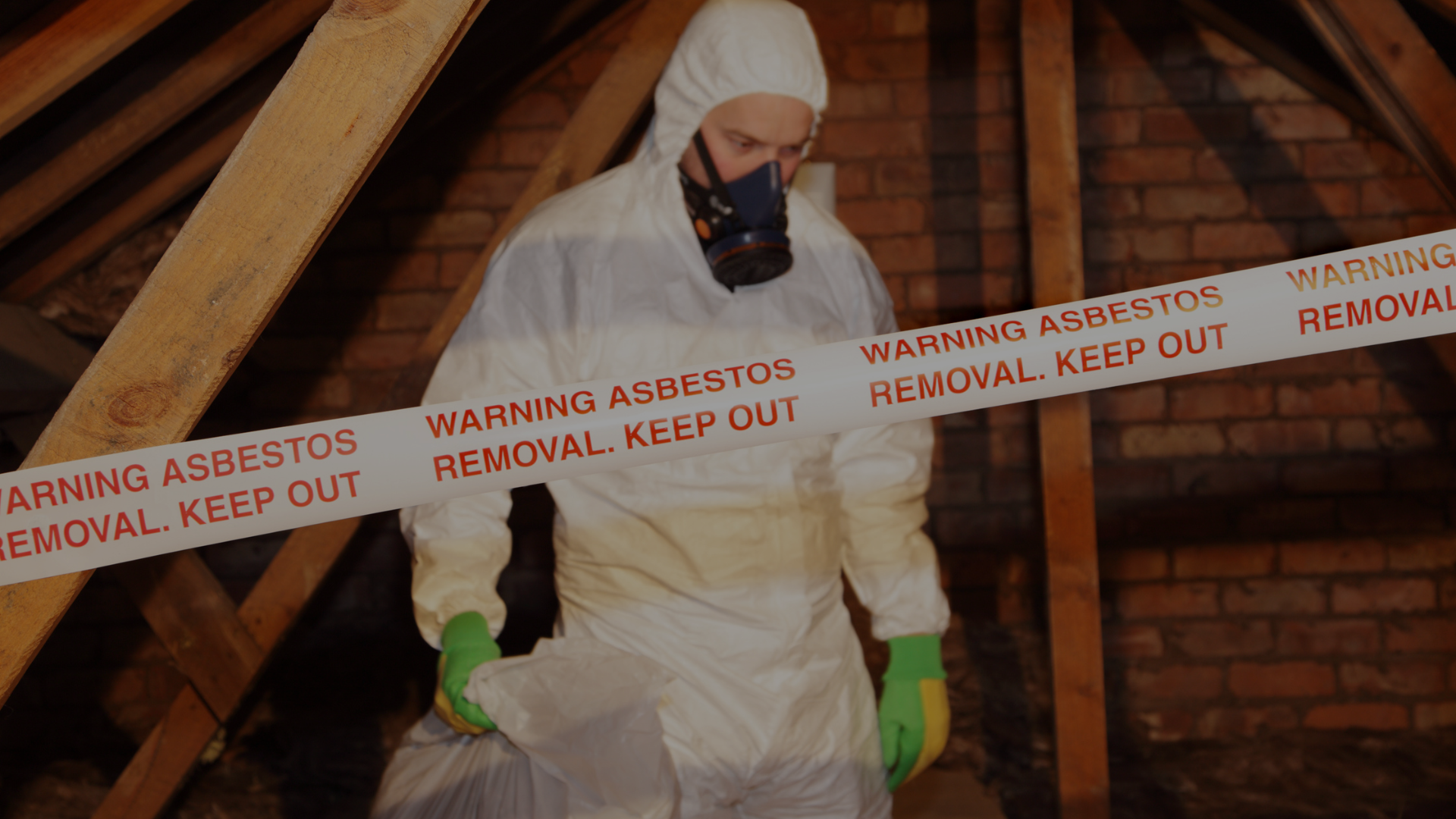 someone in hazmat suit removing asbestos